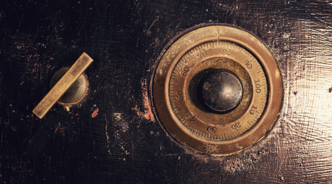 Release lever and combination lock dial on front of old safe