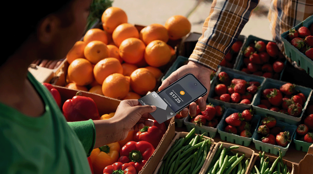 A merchant is using Tap to Pay for iphone to take a customer's payment using only their iphone. No terminal or POS system needed.