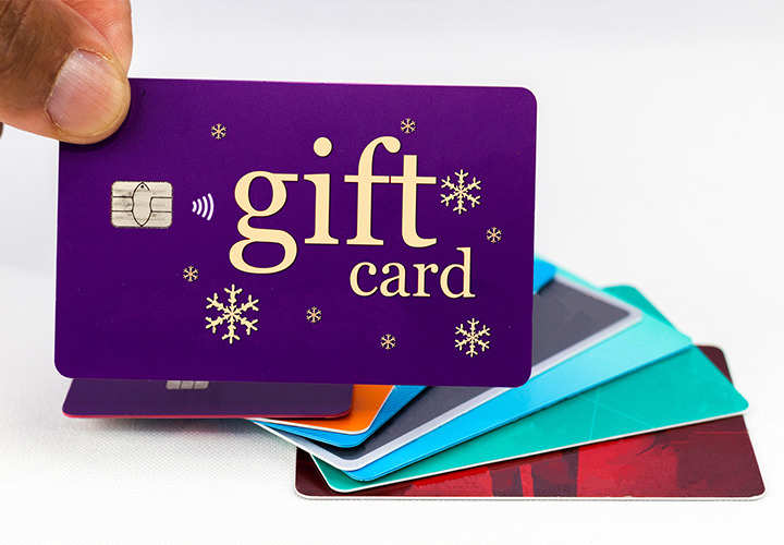Close up image of a gift card with several other spread out behind.