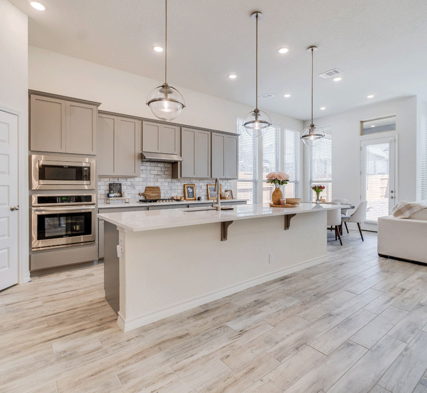 A photo of an open kitchen with fresh, updated interior finishes, flooring and appliances.
