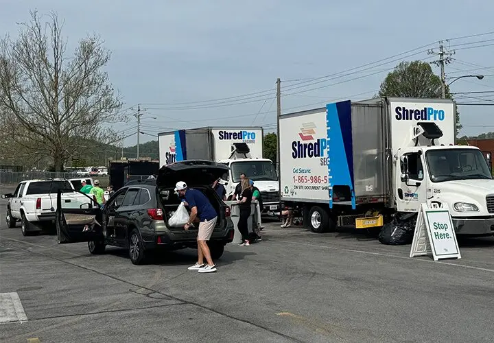 A photo of shred trucks and customers at 2025 Community Shred Day